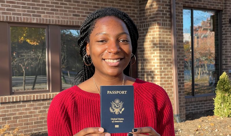 Aryn Lovell with a passport.